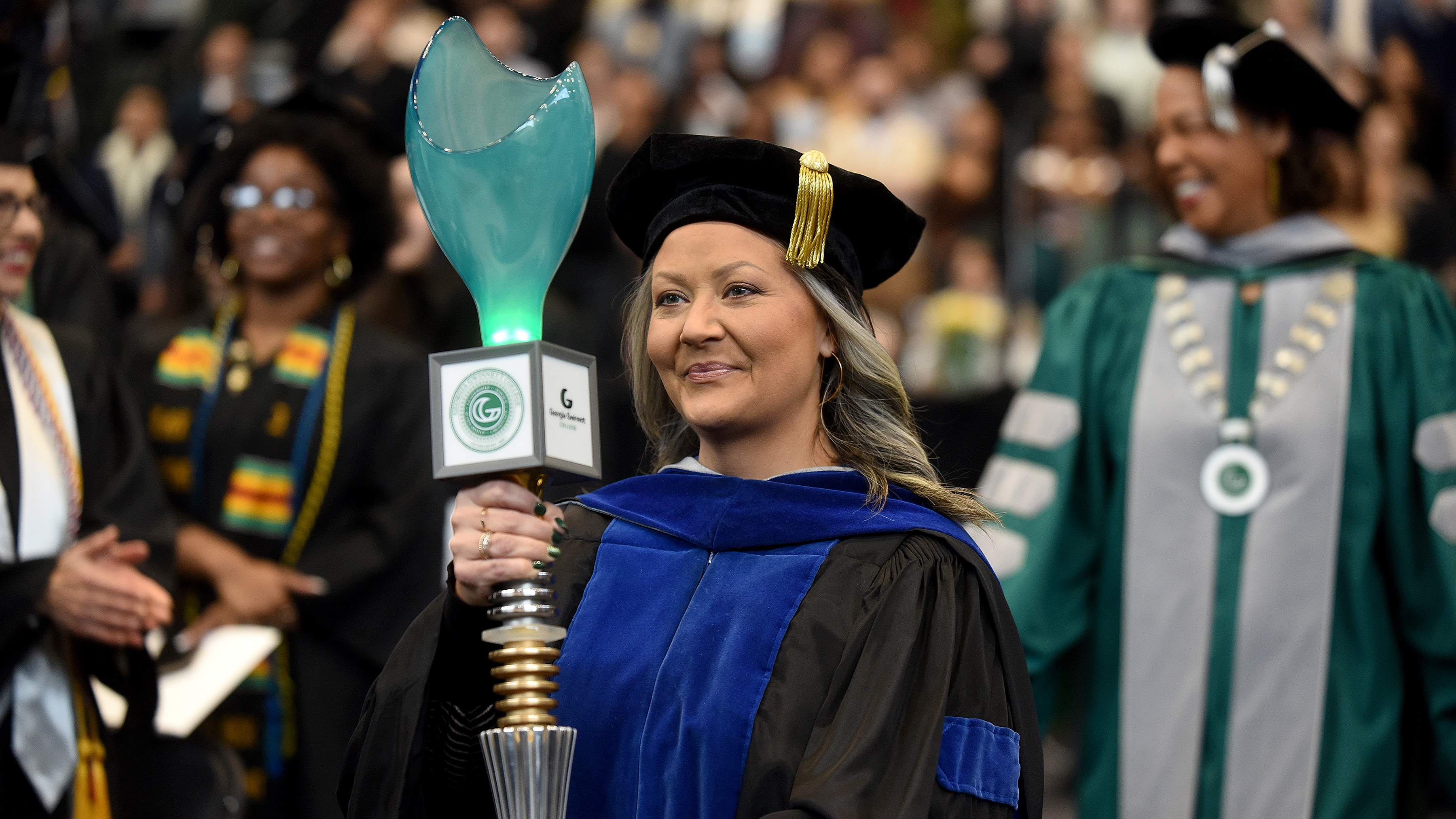 Dr. Maryann White carries mace at the fall 2024 commencement ceremony
