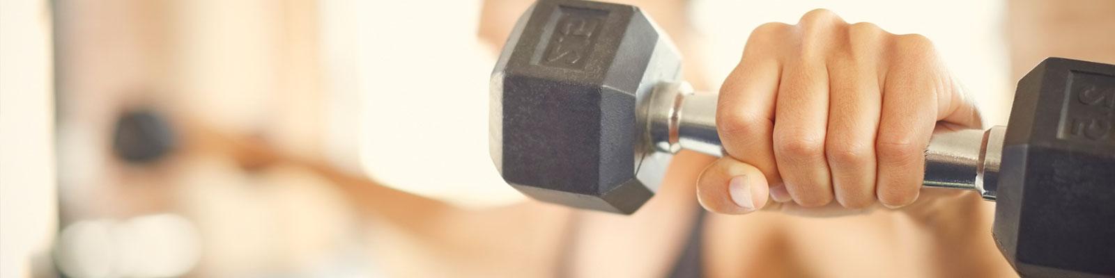 person lifting hand weights person lifting hand weights