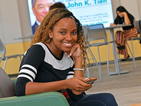 Student on cell in Building W study area