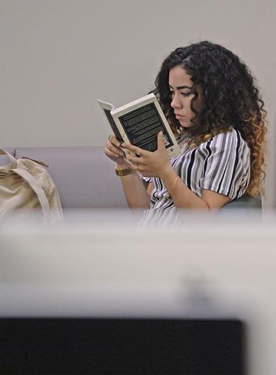 Student reading a textbook