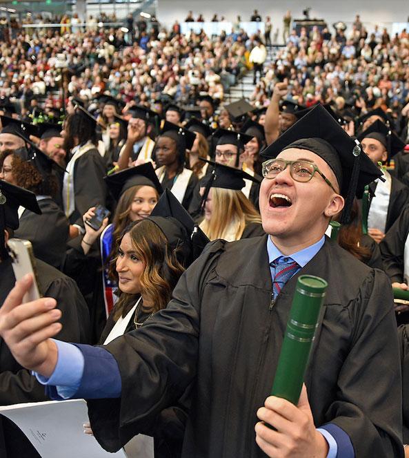 GGC grad cheering in crowd
