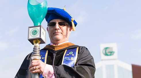 Dr. James Weisel carrying GGC Mace