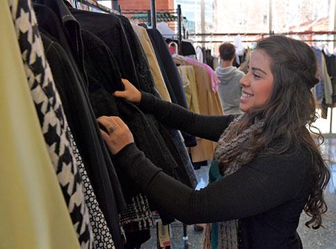 student browsing business attire selection in the career lending closet