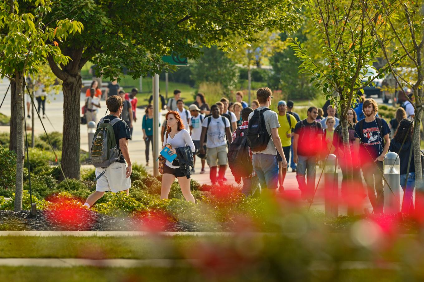 Busy GGC campus with students walking between classes.