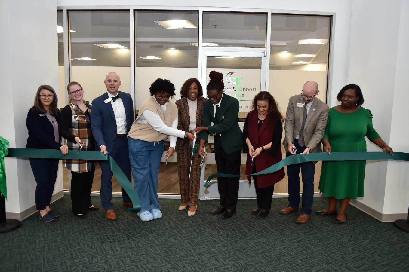 Catherine Downey, Jennifer Paulk, Dr. Matthew Robison, Amanda Ashley, GGC President Dr. Jann Jospeh, David Brown, Nancy Ciudad-Simmons, Dr. Justin Jernigan, Tia Lloyd are all smiles after cutting the ribbon to official open the Belonging Center