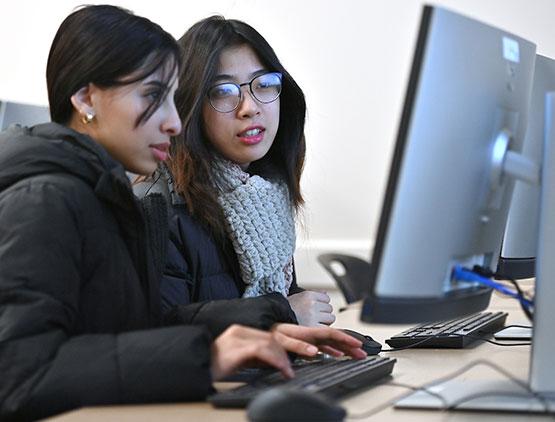 Mai Duong and Nabaa Ahmed collaborate on coding during the Winter 2025 Java Boot Camp