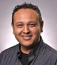 Dr. Omar Villanueva smiling at camera