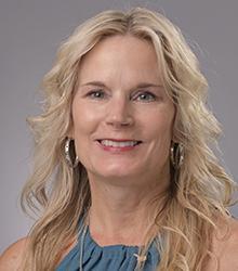 Dana K. Johnson smiling at the camera