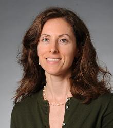 Dr. Rebecca Flynn smiling at camera