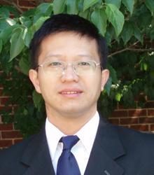 Dr. Yi Ding smiling at camera