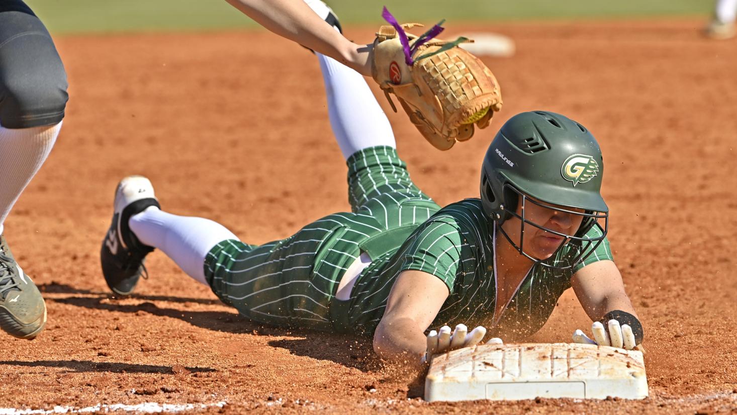 action photo of softball player playing in a game