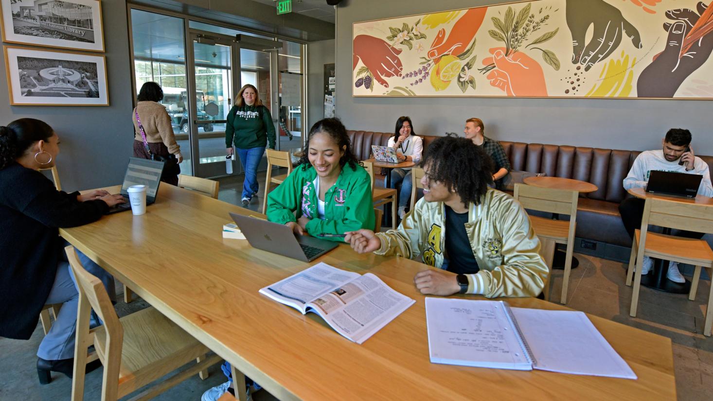 Students studying in campus coffee shop
