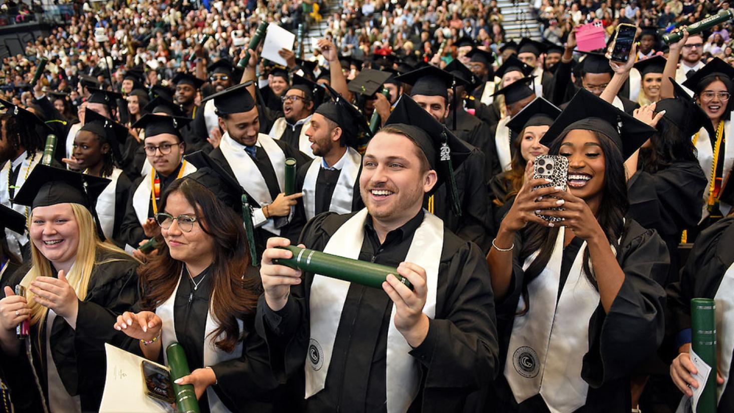 Graduate receiving diploma from GGC president