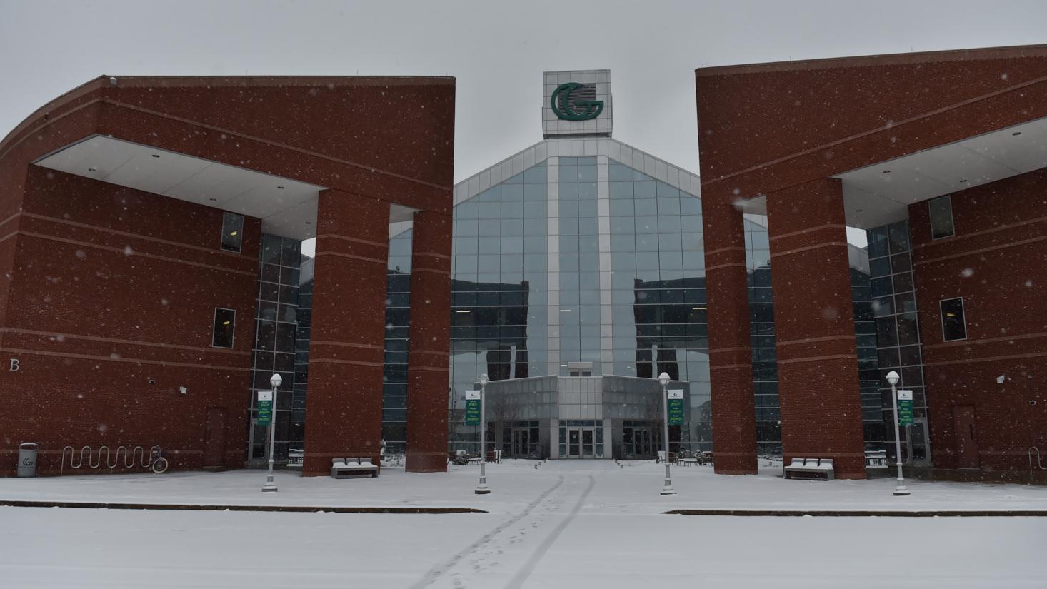 Snow covering the street in front of a building