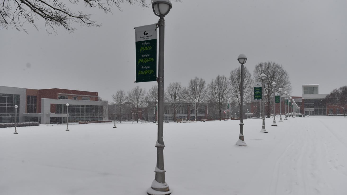 Snow covering a grassy area