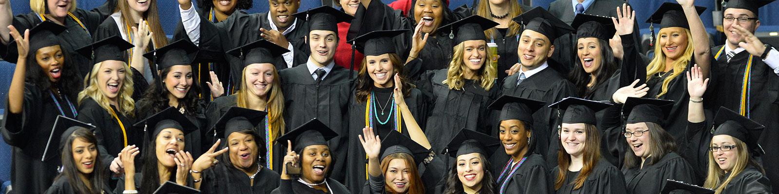 Group of cheerful GGC graduates Group of cheerful GGC graduates